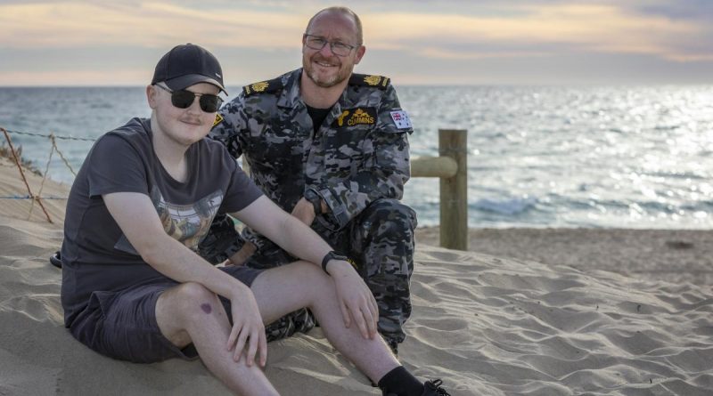 Warrant Officer Tim Cummins with his son, Jack, at Ship Wreck Bay in Golden Bay, Western Australia. Story by Petty Office Lee-Anne Cooper. Photo by Petty Officer Yuri Ramsey.