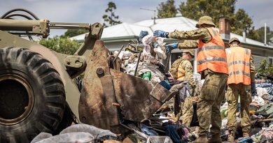 Australian Army soldiers from the 5th Engineer Regiment use earth-moving equipment to clear debris from a flood-affected house in Lismore, New South Wales, during Operation Flood Assist 2022. Photo by Corporal Jonathan Goedhart.
