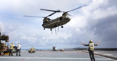 An Australian Army CH-47F Chinook helicopter conducts a vertical replenishment with HMAS Canberra to deliver humanitarian and disaster relief stores to Nomuka Island, Tonga, during Operation Tonga Assist 2022. Photo by Leading Seaman Danial Goodman.