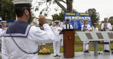 Commanding Officer HMAS Cerberus Captain Ainsley Morthorpe, centre, and Chaplain Matthew Campbell salute as Able Seaman Luke Glasson sounds the Last Post during the HMAS Yarra II commemorative service. Story by Commander Helen Ward. Photo by Leading Seaman James McDougall.