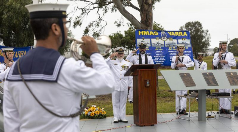 Commanding Officer HMAS Cerberus Captain Ainsley Morthorpe, centre, and Chaplain Matthew Campbell salute as Able Seaman Luke Glasson sounds the Last Post during the HMAS Yarra II commemorative service. Story by Commander Helen Ward. Photo by Leading Seaman James McDougall.