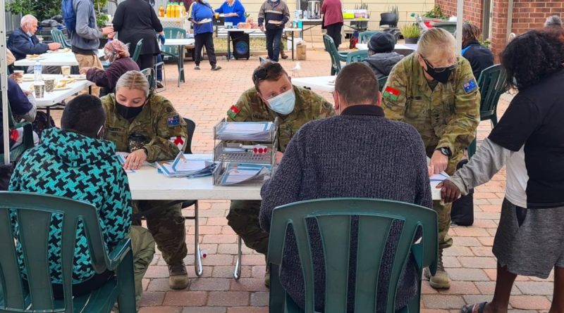 From left: Private Tori Doherty, Lieutenant Joshua Mildrum and Captain Michele Muncaster, from the 3rd Health Battalion, provide administrative support during the pop-up clinic at Stepping Stones in Port Augusta, South Australia. Story by Captain Nathan Freeman.