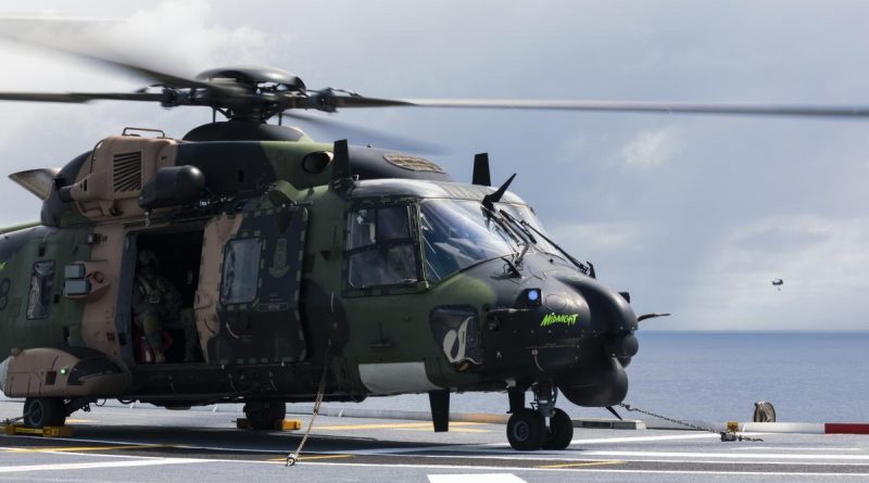 The 808 Squadron MRH-90 Taipan helicopter prepares to take-off from HMAS Canberra during Operation Tonga Assist 2022. Story by Lieutenant Brendan Trembath. Photo by Leading Seaman Daniel Goodman.