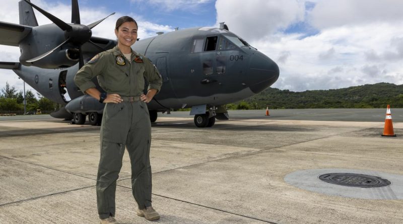 Air Force loadmaster Corporal Antonia Guterres stands on the tarmac in Palau by the C-27J Spartan aircraft she worked on during Operation Solania. Story by Flying Officer Lily Lancaster. Photo by Leading Seaman Nadav Harel.