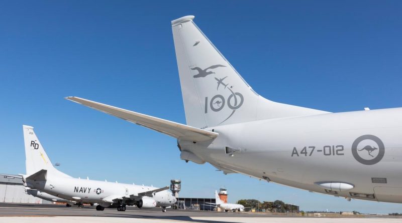 A United States Navy P-8A Poseidon taxis past a Royal Australian Air Force P-8A Poseidon on the No. 92 Wing flightline at RAAF Base Edinburgh in South Australia. Story by Eamon Hamilton. Photo by Leading Aircraftman Stewart Gould.