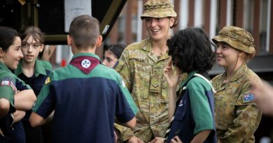 Lance Corporal Madison Parrello (centre) and Private Genna Price (right) from 7th Battalion, Royal Australian Regiment, talk to scouts in Lismore, New South Wales, during Operation Flood Assist 2022. Story by Flight Lieutenant Dee Irwin. Photo by Corporal Jonathan Goedhart.