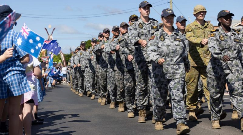 Royal Australian Navy sailors and Australian Army soldiers march down Casino's main street to the applause of locals. Story by Flight Lieutenant Dee Irwin . Photo by Corporal Jonathan Goedhart.