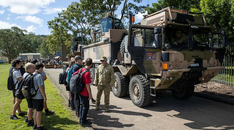 An Australian Army soldier deployed on Operation Flood Assist 2022 prepares to show Rivers Secondary College students over a Rheinmetall MAN M40 truck during a visit to the school in Lismore, New South Wales. Story and photo by Leading Seaman Jarrod Mulvihill.