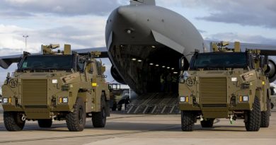 Two Bushmaster protected mobility vehicles bound for Ukraine wait to be loaded onto a C-17A Globemaster III aircraft at RAAF Base Amberley. Photo by Leading Aircraftwoman Emma Schwenke.
