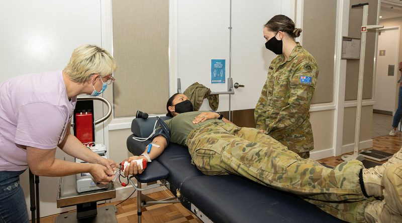 Sergant Nicole Hall from 1st Armoured Regiment donates blood at the Red Cross Lifeblood pop-up donor centre in Ballina, New South Wales, while deployed on Operation Flood Assist 2022. Story by Corporal Jacob Joseph. Photo by Leading Seaman Jarrod Mulvihill.