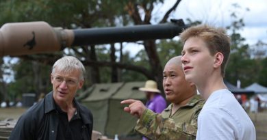 Sergeant Wei Huang, from the School of Armour, discusses the vehicles on display with Henry Rogers and his father, Tom, at the Puckapunyal Military Area community open day. Story by Major Carrie Robards. Photo by Private Kelsey Innes.