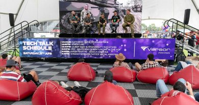 Australian Defence Force personnel discuss roles and opportunities in the ADF at the Tech Talk stage during the 2022 Australian Formula 1 Grand Prix at Albert Park in Melbourne. Story by Flight Lieutenant Benjamin Shuhyta. Photo by Leading Seaman James McDougall.