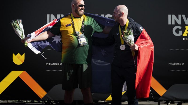 Invictus Games 2020 Team Australia competitor Steve James, left, celebrates receiving a gold medal in the mixed IF5678 discus event at the athletics meet at Invictus Games Park in The Hague, Netherlands. Story by Lucy Redford-Hunt.