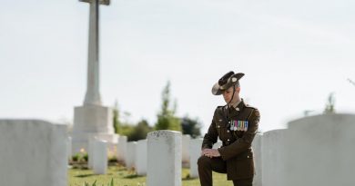 Major Christopher Pitman from Australia's Federation Guard pauses to reflect at the headstone of fallen Australian soldier from the First World War in Villers-Bretonneux Military Cemetery, France. Story by Captain Sarah Kelly. Photo by Corporal John Solomon.
