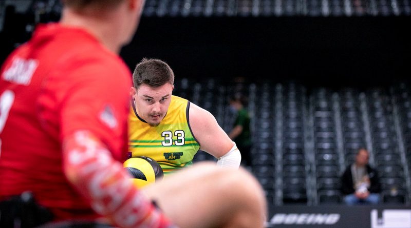 Invictus Games 2020 Team Australia competitor Braedon Griffiths attacks the try line during a wheelchair rugby pool match against Canada at Invictus Games Park in The Hague, Netherlands. Story by Lucy Redford-Hunt. Photo by Flight Sergeant Ricky Fuller.