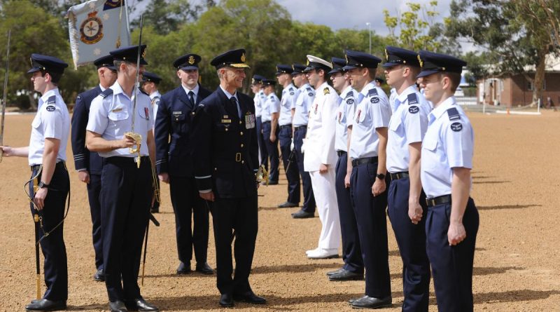 Commander of Air Combat Group, Air Commodore Tim Aslop, centre, talks with a Air Force officer from No. 265 PC-21 Australian Defence Force pilots course during the graduation ceremony at RAAF Base Pearce, Western Australia. Story by Peta Magorian. Photo by Chris Kershaw.