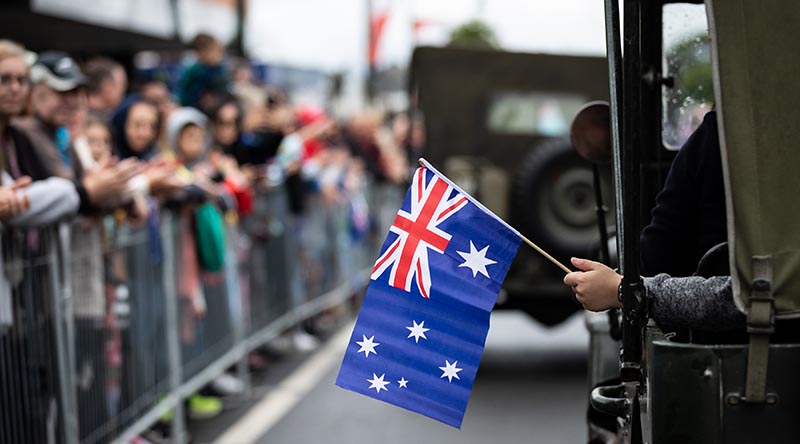 Crowds line the strreet to see the ANZAC Day march in Camden, NSW. Photo by Leading Seaman David Cox.