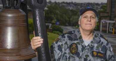 Chief Petty Officer Sharon Brown stands next to the historic HMAS Penguin bell in Sydney. Story by Corporal Veronica O'Hara. Photo by Able Seaman Benjamin Ricketts.