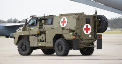 A Bushmaster protected mobility vehicle ambulance variant awaiting loading onto a C-17 Globemaster at RAAF Base Amberley in Queensland. Photo by Kym Smith.