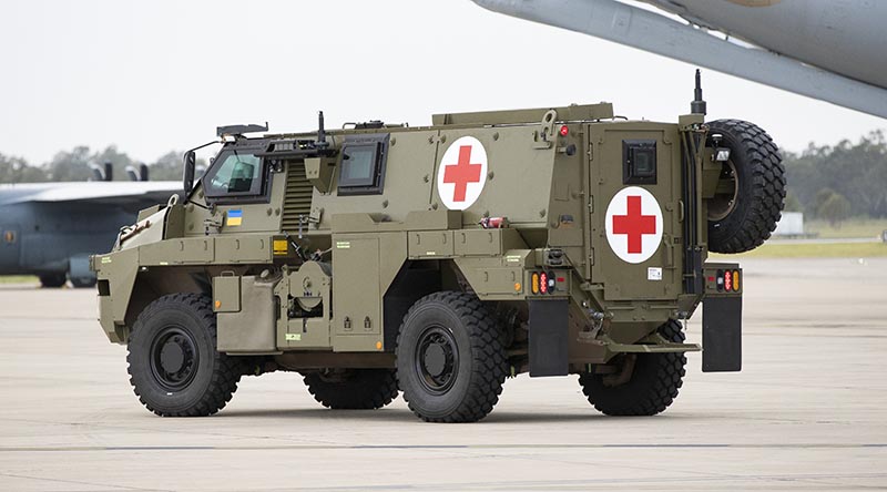 A Bushmaster protected mobility vehicle ambulance variant awaiting loading onto a C-17 Globemaster at RAAF Base Amberley in Queensland. Photo by Kym Smith.