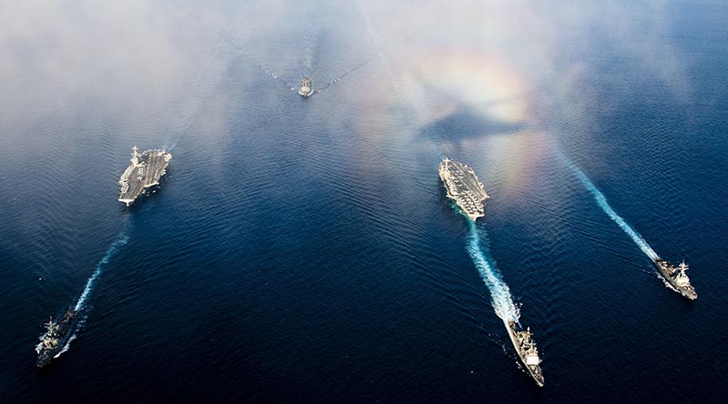 The aircraft carrier USS John C. Stennis and the aircraft carrier USS George Washington underway in the Andaman Sea with ships from their carrier strike groups. US Navy photo by Mass Communication Specialist 3rd Class Kenneth Abbate.