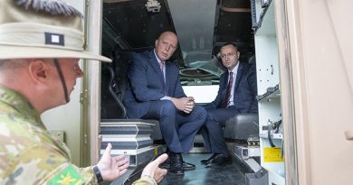 Minister for Defence Peter Dutton sits inside a Bushmaster protected mobility vehicle with Ukrainian Ambassador to Australia Vasyl Myroshnychenko, talk to Commander of 1st Division Major General Scott Winter at RAAF Base Amberley, just before the protected mobility vehicle was flown to Ukraine to assist in their war effort against Russia. Photo by Kym Smith.