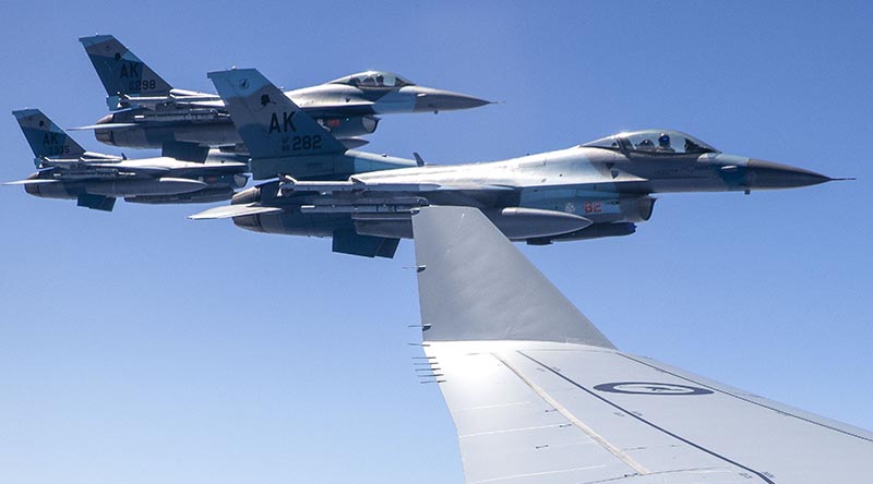 United States Air Force F-16C aircraft from the 18th Aggressor Squadron conduct air-to-air refuelling operations with a Royal Australian Air Force KC-30A multi-role tanker transport from No.33 Squadron during Exercise Diamond Shield. Photo by Corporal Kieren Whiteley.