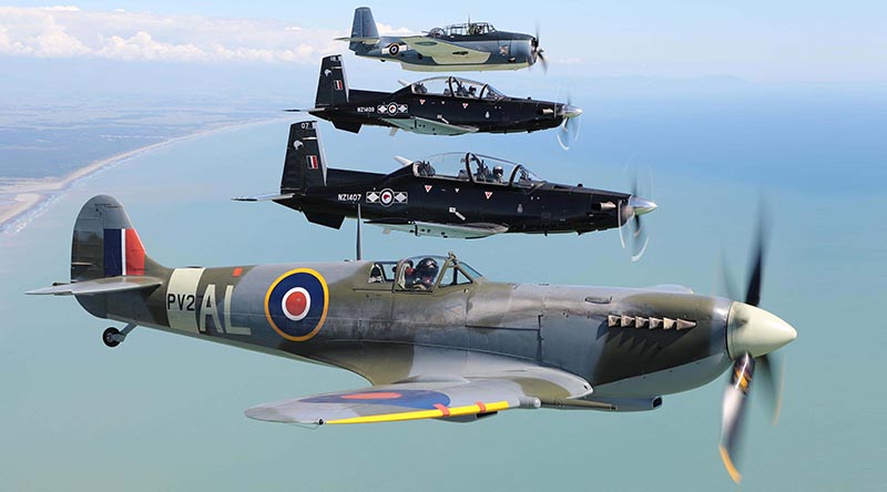 Air Force Heritage Flight aircraft the Spitfire (bottom of photo) and Avenger (top) flying in formation with Texans from the Central Flying School at Ohakea. NZDF photo.