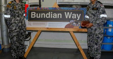 Lieutenant Sarah Harrington (left) and Able Seaman Boatswain's Mate Jahlaya Weazel, look over the new Bundian Way signage for HMAS Supply's passageway. Story by Warrant Officer Class 2 Max Bree. Photo by Able Seaman Benjamin Ricketts.