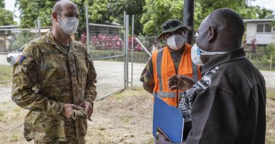 Chaplain Haydn Parsons talks with Republic of Fijian Military Forces soldier Staff Sergeant Eliki Seasea, centre, and Pastor Martin Nehemiah at Burns Creek Clinic in Solomon Islands. Story by Captain Peter March. Photo by Corporal Jarrod McAneney.