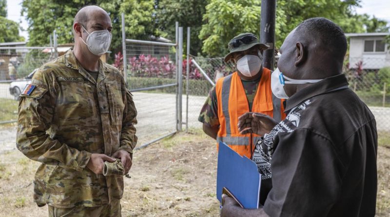 Chaplain Haydn Parsons talks with Republic of Fijian Military Forces soldier Staff Sergeant Eliki Seasea, centre, and Pastor Martin Nehemiah at Burns Creek Clinic in Solomon Islands. Story by Captain Peter March. Photo by Corporal Jarrod McAneney.