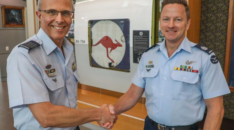 Officer Commanding of No. 92 Wing, Group Captain Paul Carpenter (left), officially hands over the P-3 Orion A9-754 memorial display to sergeants' mess committee chairman Warrant Officer Peter Christensen at RAAF Base Edinburgh in Adelaide. Story by Flight Lieutenant Claire Burnet.
