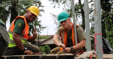 Australian Army sapper Logan Kocbek, from 2nd Combat Engineer Regiment, and an RFMF engineer secure timber decking during construction of the footbridge. Story by Flying Officer Lily Lancaster. Photo by Corporal Matthew Kenny.