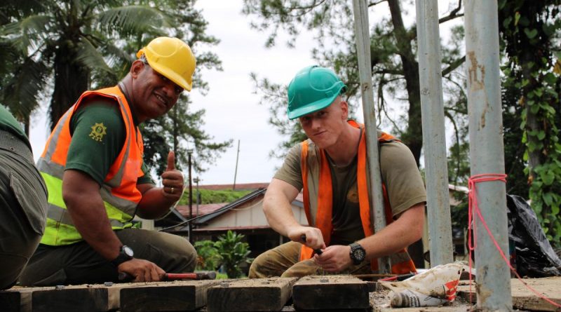 Australian Army sapper Logan Kocbek, from 2nd Combat Engineer Regiment, and an RFMF engineer secure timber decking during construction of the footbridge. Story by Flying Officer Lily Lancaster. Photo by Corporal Matthew Kenny.