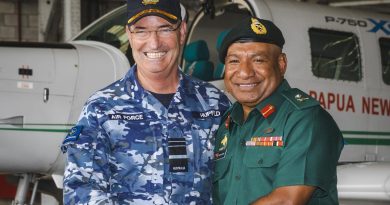 Chief of Royal Australian Air Force, Air Marshal Mel Hupfeld and Major General Mark Goina (right), Chief of Papua New Guinea Defence Force, shake hands after signing an aviation safety memorandum of understanding at Air Transport Wing in Port Moresby. Story by John Noble.