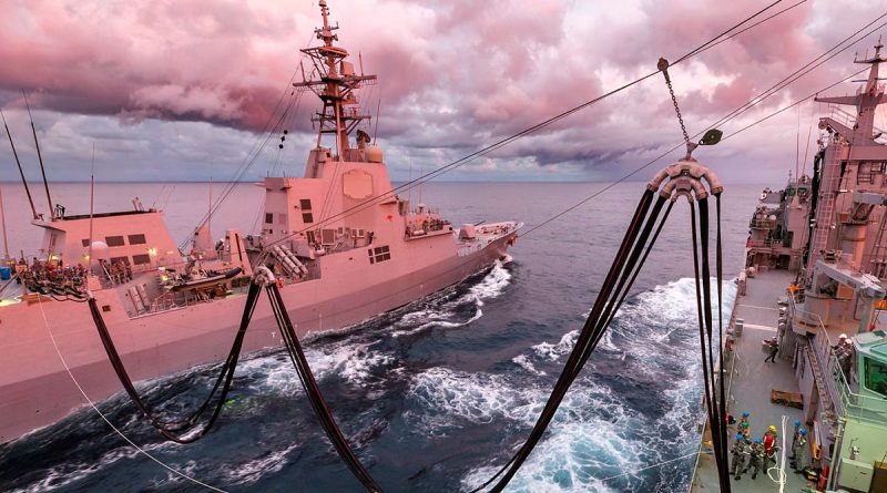 HMAS Supply conducts a replenishment at sea with HMAS Sydney, off the east coast of Australia. Story by Lieutenant Yvette Goldberg. Photo by Able Seaman Jarryd Capper.