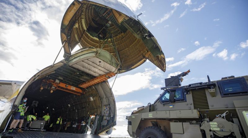 An Australian Government-donated Bushmaster protected mobility vehicle bound for Ukraine is loaded onto an Antonov AN-124 cargo aircraft at RAAF Base Amberley in Queensland. Story by Lucy Benjamin.