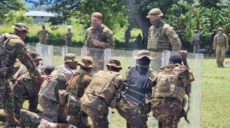 Australian Army soldiers provide guidance to PNGDF soldiers about creating a shield wall during population protection and control training as part of Exercise Olgeta Warrior. Story by Captain Jessica O’Reilly.