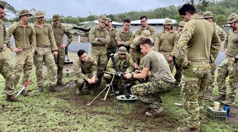 Australian Army soldiers, from 6th Battalion, Royal Australian Regiment, watch a demonstration of the M224 60mm mortar by United States Marine Corps personnel at Shoalwater Bay training area, near Rockhampton.