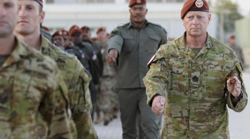 Warrant Officer Class One Mick Dewar takes part in the 40th anniversary parade at South Camp in Sharm el-Sheikh, Egypt. story and photo by Petty Officer Lee-Anne Cooper.