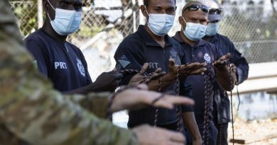 Solomon Islands Police Force officers practise their knot tying skills as part of practical maritime safety training with the Australian Defence Force in the use and maintenance of aluminium long boats in Honiara. Photo by Corporal Julia Whitwell.