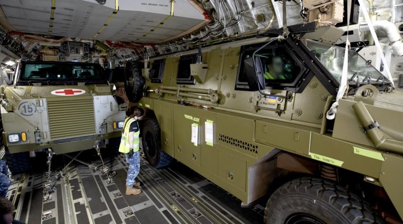 Converted Bushmaster protected mobility vehicles bound for Ukraine are loaded onto a C-17A Globemaster III aircraft at RAAF Base Amberley, Queensland. Story by Captain Mike Edwards. Photo by Leading Aircraftwoman Kate Czerny.