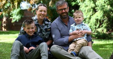 Warrant Officer Natasha McRoe and her husband, Petty Officer Daniel McRoe, with their children, Flynn and Riley, at the Royal Tasmanian Botanical Gardens in Hobart.