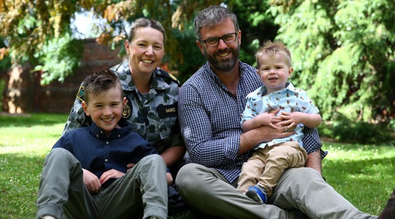 Warrant Officer Natasha McRoe and her husband, Petty Officer Daniel McRoe, with their children, Flynn and Riley, at the Royal Tasmanian Botanical Gardens in Hobart.
