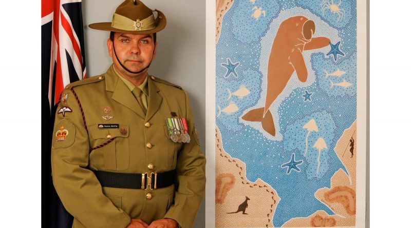 Then Warrant Officer Class 2 Darren Moffitt with his artwork titled “The Salute”. It depicted a dugong as the centrepiece was created for the Royal Australian Navy’s centenary in 2011. It told the story of Indigenous service and connection to Navy. Story by Warrant Officer Class Two Max Bree.
