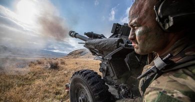 A New Zealand artilleryman in position during firing of an L119 light gun on Exercise Long Tan 2022. Photo by Corporal Naomi James.