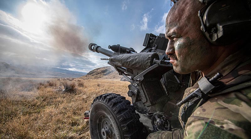 A New Zealand artilleryman in position during firing of an L119 light gun on Exercise Long Tan 2022. Photo by Corporal Naomi James.