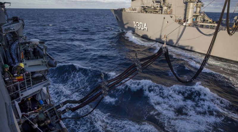 A fuel line is padded from HMAS Stalwart, right, to HMAS Parramatta during Stalwart's first replenishment at sea. Story by Lieutenant Gary McHugh. Photo by Leading Seaman Leo Baumgartner.