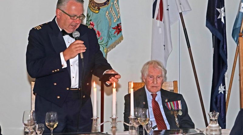 Squadron Leader Michael Veitch and President of the No. 30 Squadron RAAF Beaufighter Association Bruce Robertson at the No. 30 Squadron anniversary dinner. Story by By Flight Lieutenant Dee Irwin. Photo by Petty Officer Rick Prideaux.