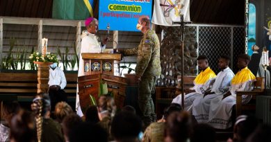 Australian Army padre Chaplain Haydn Parsons is presented a farewell gift by Archbishop Christopher Cardone during a service at Holy Cross Cathedral in Honiara, Solomon Islands. Story and photo by Corporal Julia Whitwell.